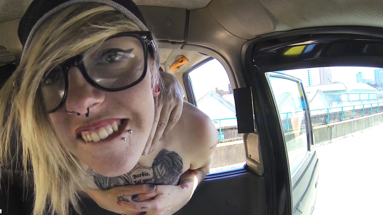 Blonde with glasses and big tattoos